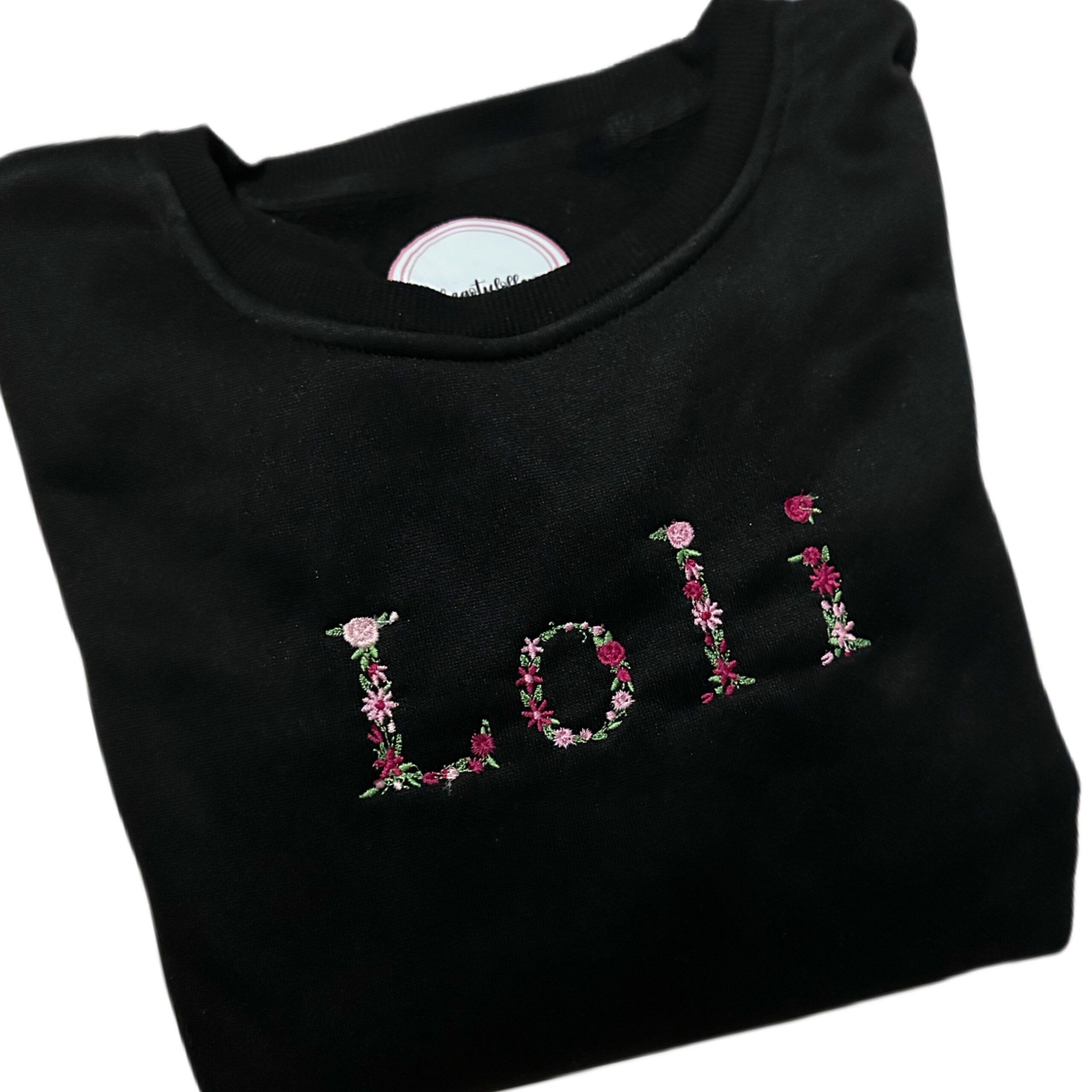 Sudadera bordado nombre con flores tonos rosas